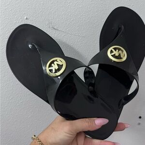 Michael Kors Black Flip Flops with Gold Emblem